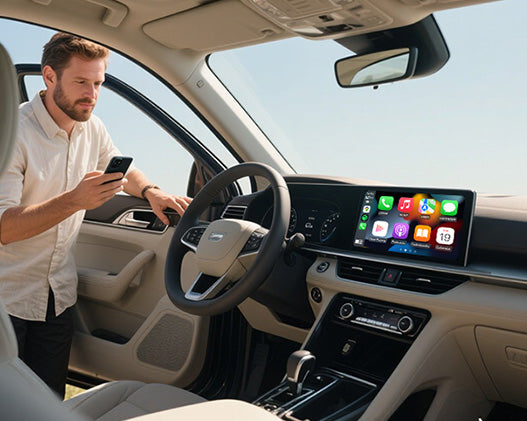 Man connecting smartphone to car display using Ottocast wireless CarPlay adapter for seamless navigation and entertainment
