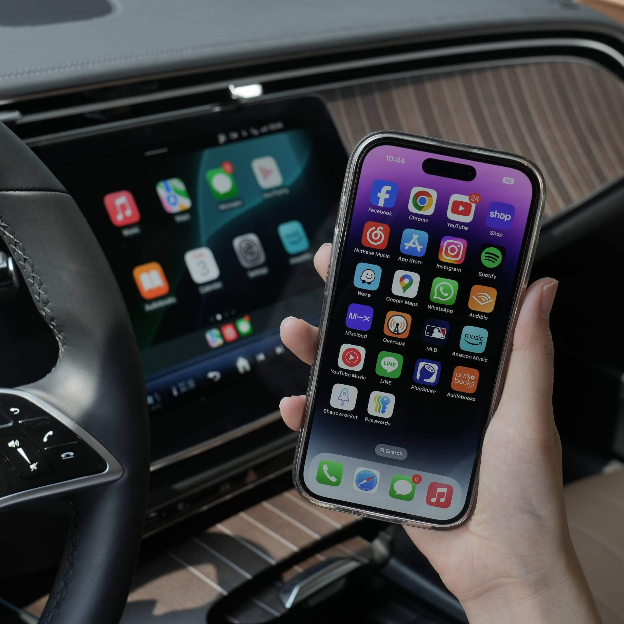 Ottocast adapter turning wired CarPlay into wireless connection with iPhone apps on car dashboard display